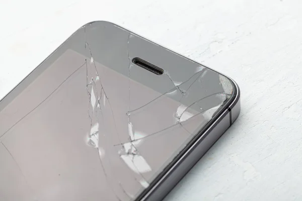 Broken glass phone. Cracks on the display of a mobile phone