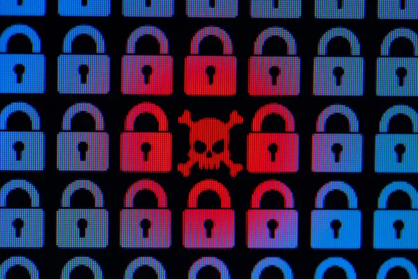 Skull and bone as a symbol of hacking programs or personal information and data. Cyber crime. Blue pixel padlock lock and red skull with bones on a black background, close-up