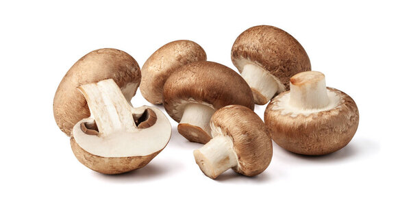 Two fresh mushrooms champignons, one whole and the other cut in half isolated on white background with clipping path