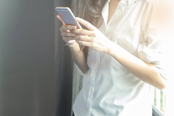 Close-up of female hands using smart phone 