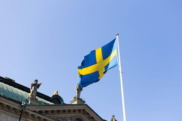 Flag of of Sweden against House of Nobility Riddarhuset