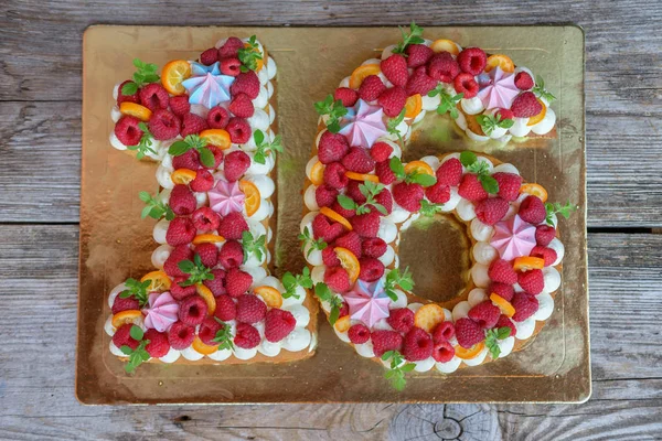 beautiful homemade birthday cake in the form of the number sixteen. the view from the top