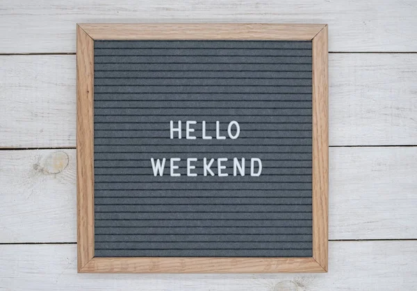 Felt board with text in English hello weekend on a white wooden board background — Stock Photo, Image