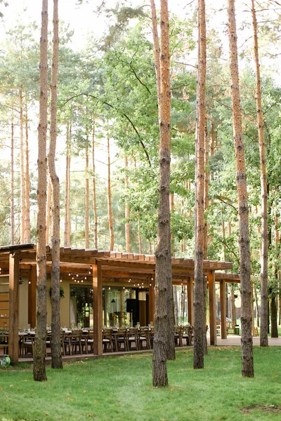 Wooden restaurant in forest.
