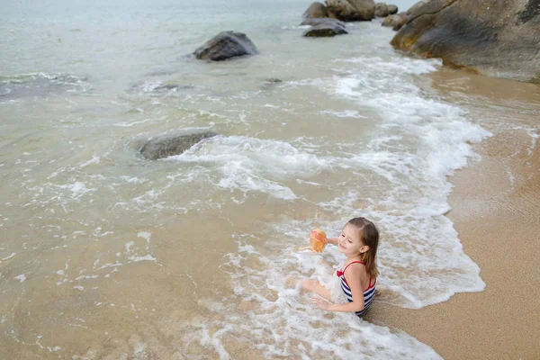 Little Caucasian Girl Doll Wearing Swimsuit Sitting Sand Sea Waves — Stock Photo, Image