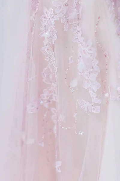 Closeup pink dress and embroidery on fabric. — Stock Photo, Image