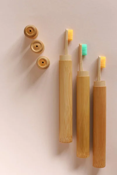 A family set of three wooden toothbrushes on isolated background. — Stock Photo, Image