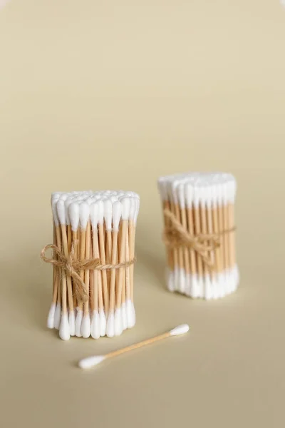 Cotton swabs with wooden sticks isolated on background with copy space. — Stock Photo, Image
