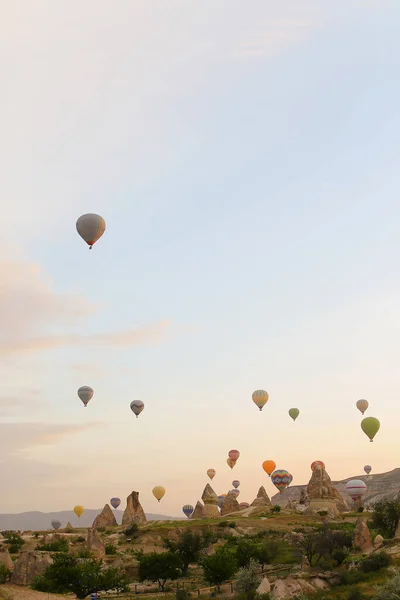 Amazing hot air balloons flying over Cappadocia rocks in Turkey. — Stock Photo, Image