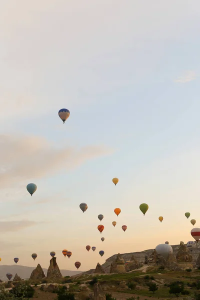 Many wonderful l hot air balloons flying over Cappadocia rocks in Turkey. — Stock Photo, Image