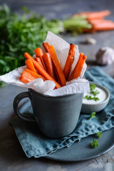 Vegan carrot fries with sour cream and garlic dip
