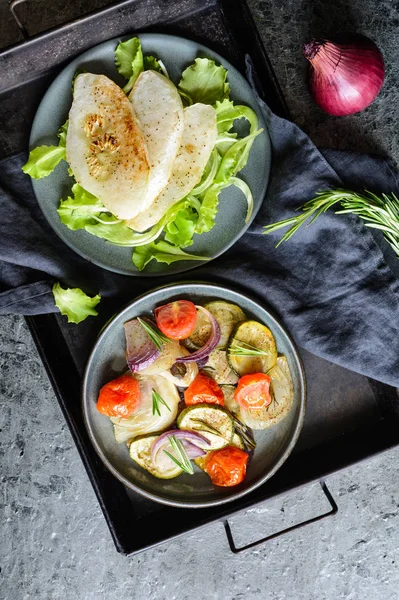 Fried white patty pan squash slices with vegetable garnish