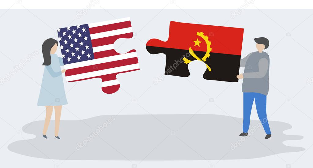 Couple holding two puzzles pieces with American and Angolan flags. United States of America and Angola national symbols together.
