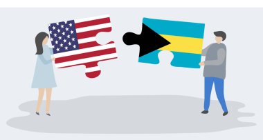 Amerikan ve Bahama bayrakları ile iki bulmaca parçaları tutan çift. Amerika Birleşik Devletleri ve Bahamalar ulusal sembolleri birlikte.