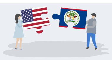 Amerikan ve Belizean bayrakları ile iki bulmaca parçaları tutan çift. Amerika Birleşik Devletleri ve Belize ulusal sembolleri birlikte.