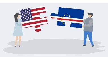 Amerikan ve Cabo Verdean bayrakları ile iki bulmaca parçaları tutan çift. Amerika Birleşik Devletleri ve Cape Verde ulusal sembolleri birlikte.