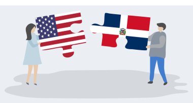 Amerikan ve Dominik bayrakları ile iki bulmaca parçaları tutan çift. Amerika Birleşik Devletleri ve Dominik Cumhuriyeti ulusal sembolleri birlikte.
