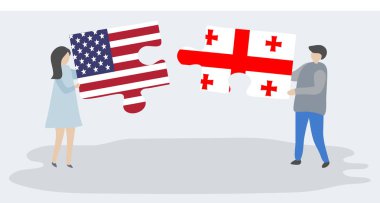 Amerikan ve Gürcü bayrakları ile iki bulmaca parçaları tutan çift. Amerika Birleşik Devletleri ve Gürcistan ulusal sembolleri birlikte.