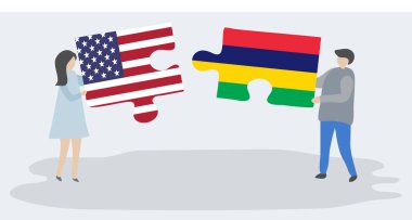 Amerikan ve Moritanya bayrakları ile iki bulmaca parçaları tutan çift. Amerika Birleşik Devletleri ve Mauritius ulusal sembolleri birlikte.