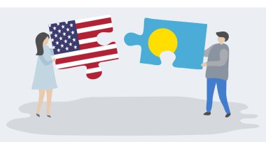 Amerikan ve Palauan bayrakları ile iki bulmaca parçaları tutan çift. Amerika Birleşik Devletleri ve Palau ulusal sembolleri birlikte.