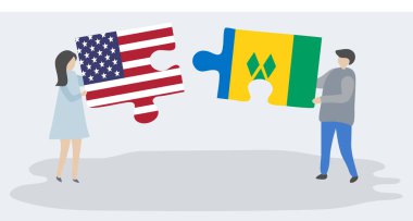 Amerikan ve Vincent bayrakları ile iki bulmaca parçaları tutan çift. Amerika Birleşik Devletleri ve Saint Vincent ve Grenadinler ulusal semboller birlikte.