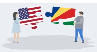 Amerikan ve Seychellois bayrakları ile iki bulmaca parçaları tutan çift. Amerika Birleşik Devletleri ve Seyşeller ulusal semboller birlikte.