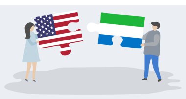Amerikan ve Sierra Leone bayrakları ile iki bulmaca parçaları tutan çift. Amerika Birleşik Devletleri ve Sierra Leone ulusal sembolleri birlikte.