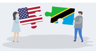 Amerikan ve Tanzanya bayrakları ile iki bulmaca parçaları tutan çift. Amerika Birleşik Devletleri ve Tanzanya ulusal sembolleri birlikte.