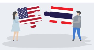 Amerikan ve Tay bayrakları ile iki bulmaca parçaları tutan çift. Amerika Birleşik Devletleri ve Tayland ulusal sembolleri birlikte.