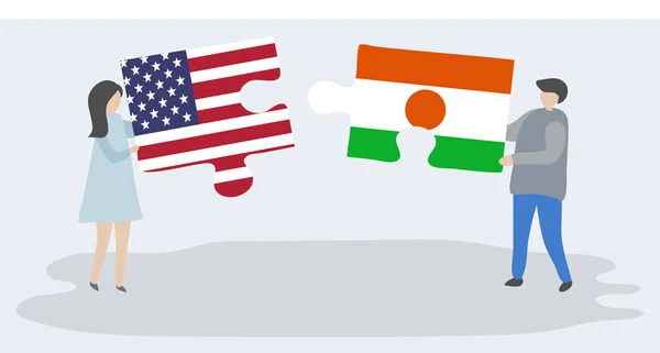 Paar Houden Twee Puzzels Stukken Met Amerikaanse Nigerien Vlaggen Verenigde — Stockvector