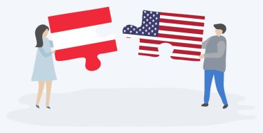 Avusturya ve Amerikan bayrakları ile iki bulmaca parçaları tutan çift. Avusturya ve Amerika Birleşik Devletleri ulusal sembolleri birlikte.