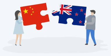 Çift Çin ve Nz bayrakları ile iki bulmaca parçaları tutan. Çin ve Yeni Zelanda ulusal sembolleri birlikte.