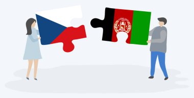 Çek ve Afgan bayrakları ile iki bulmaca parçaları tutan çift. Çek Cumhuriyeti ve Afganistan ulusal sembolleri birlikte.