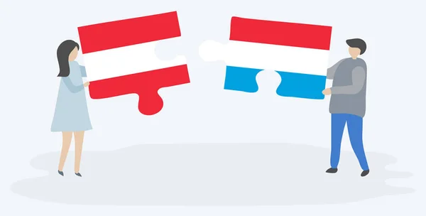 Osztrák Luxemburgi Zászlókkal Két Rejtvénydarabot Egy Pár Tart Ausztria Luxemburg — Stock Vector