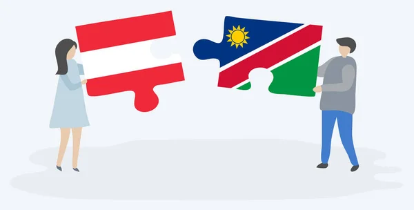 Pareja Sosteniendo Dos Piezas Rompecabezas Con Banderas Austriacas Namibias Austria — Vector de stock