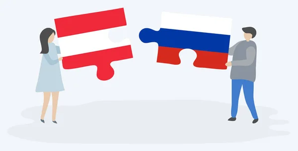 Para Trzyma Dwa Puzzle Kawałki Austriackich Rosyjskich Flag Symbole Narodowe — Wektor stockowy