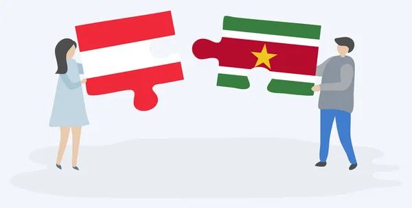 Pareja Sosteniendo Dos Piezas Rompecabezas Con Banderas Austriacas Surinamesas Austria — Vector de stock