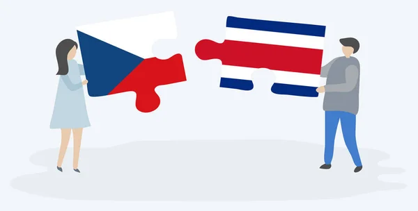 一对夫妇拿着两块拼图 上面挂着捷克和哥斯达黎加国旗 捷克共和国和哥斯达黎加国家符号在一起 — 图库矢量图片