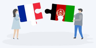 Fransız ve Afgan bayrakları ile iki bulmaca parçaları tutan çift. Fransa ve Afganistan ulusal sembolleri birlikte.