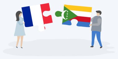 Fransız ve Comoran bayrakları ile iki bulmaca parçaları tutan çift. Fransa ve Komorlar ulusal sembolleri birlikte.