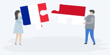 Fransız ve Monegasque bayrakları ile iki bulmaca parçaları tutan çift. Fransa ve Monako ulusal sembolleri birlikte.
