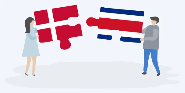 Pareja Dibujos Animados Con Dos Piezas Rompecabezas Con Banderas Danesas — Vector de stock