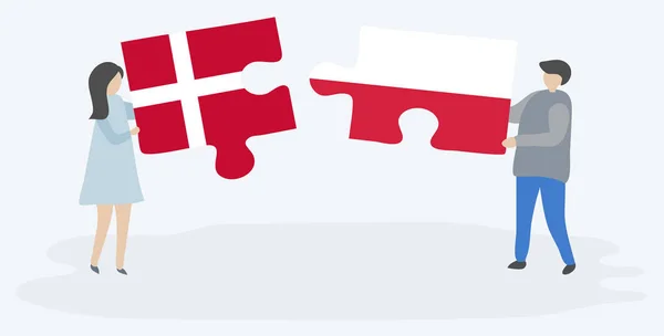 Para Trzyma Dwa Puzzle Kawałki Duńskimi Polskimi Flagami Dania Polska — Wektor stockowy