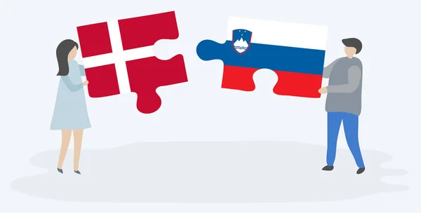 Par Som Innehar Två Pusselbitar Med Danska Och Slovenska Flaggor — Stock vektor