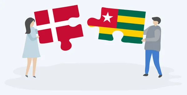 Пара Держащая Две Головоломки Датскими Тоголезскими Флагами Государственные Символы Дании — стоковый вектор