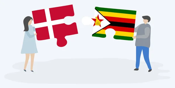 Çift Danimarka Zimbabve Bayrakları Ile Iki Bulmaca Parçaları Tutan Danimarka — Stok Vektör