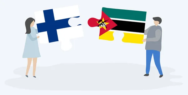 Ζευγάρι Που Κρατά Δύο Κομμάτια Παζλ Φινλανδικές Και Μοζαμβίκης Σημαίες — Διανυσματικό Αρχείο