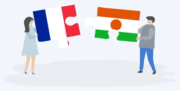 Couple Tenant Deux Pièces Puzzles Avec Des Drapeaux Français Nigériens — Image vectorielle