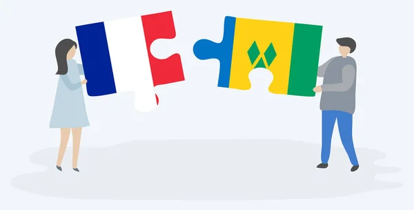 一对夫妇拿着两个拼图 上面挂着法国和文森特国旗 法国和圣文森特和格林纳丁斯国家象征在一起 — 图库矢量图片