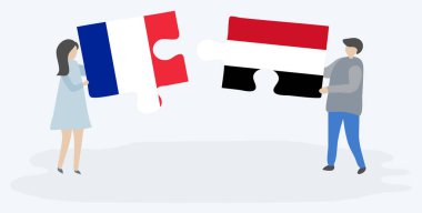 Fransız ve Yemen bayrakları ile iki bulmaca parçaları tutan çift. Fransa ve Yemen ulusal sembolleri birlikte.